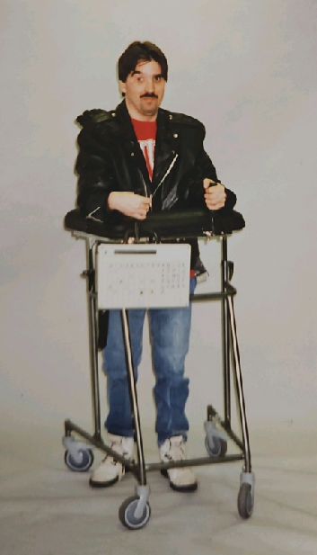 Man holding Gunnell Wheelchair in Vintage Image